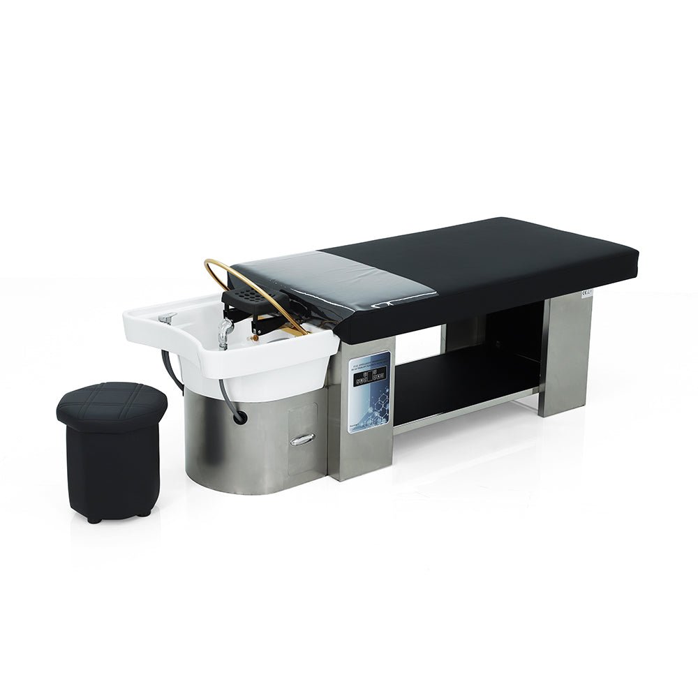 Lumora head spa bed, three-quarter view with operator stool