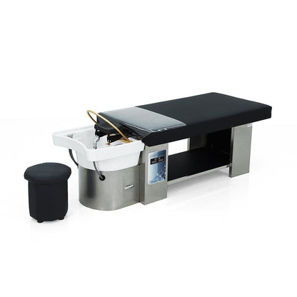 Lumora head spa bed, three-quarter view with operator stool